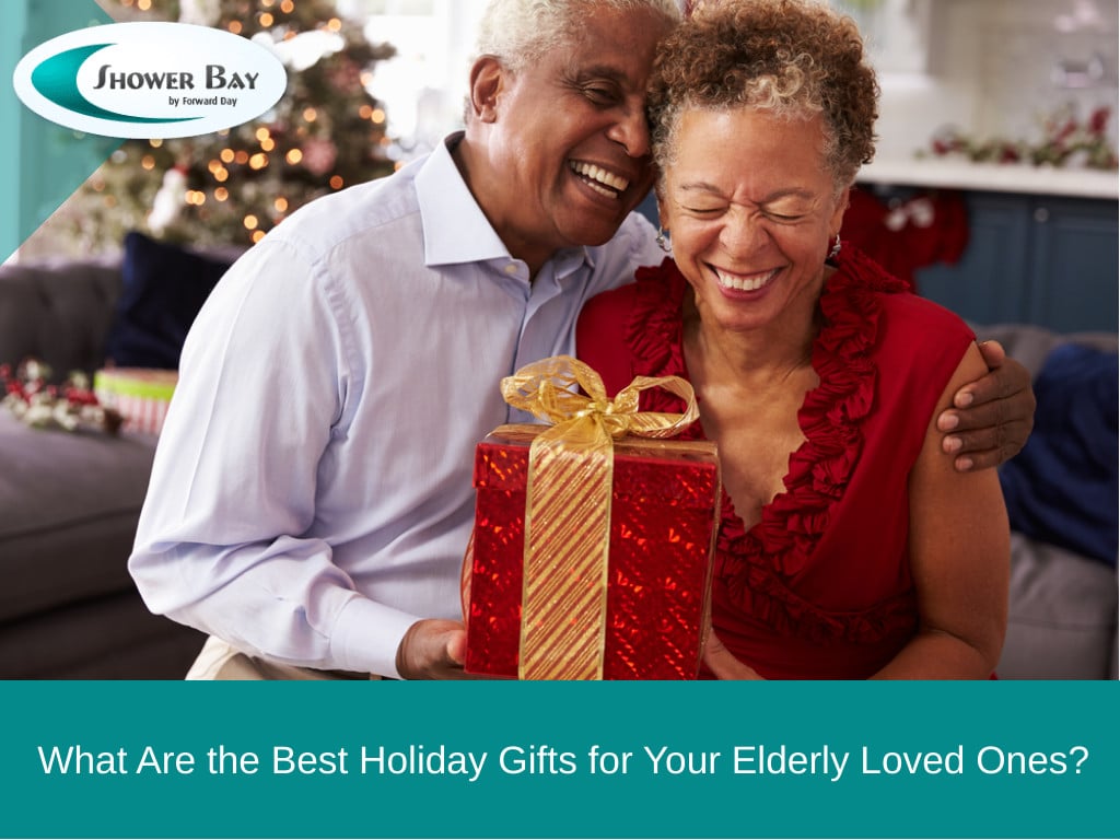 Elderly couple laughing with a holiday gift in their hands