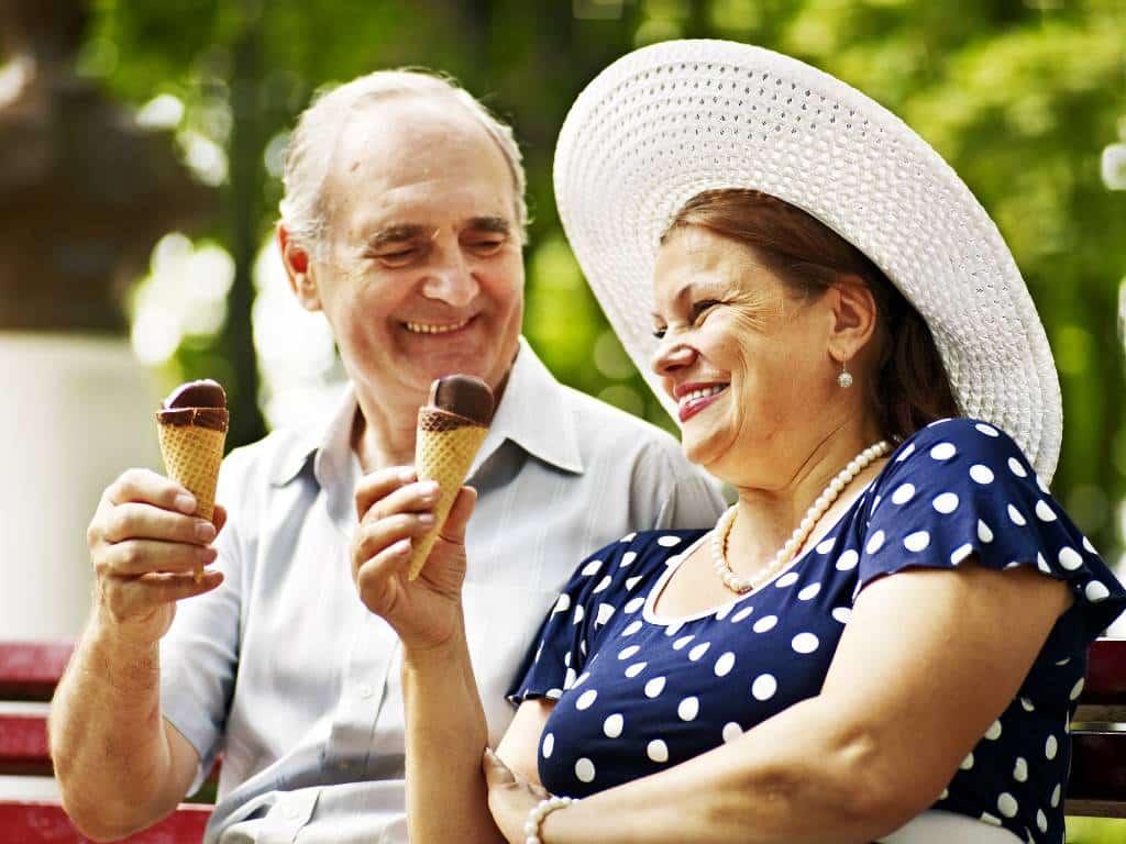 Elderly couple enjoying ice cream